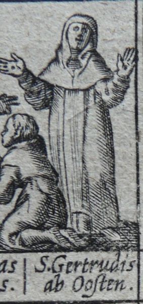 Met de stigmata (kruiswondertekenen van Christus) in haar handen.