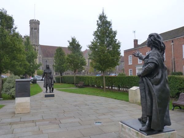 Op de voorgrond Ethelbert die zijn hand uitstrekt naar Bertha. achter haar de poort naar de universiteit, genoemd naar paus Gregorius.