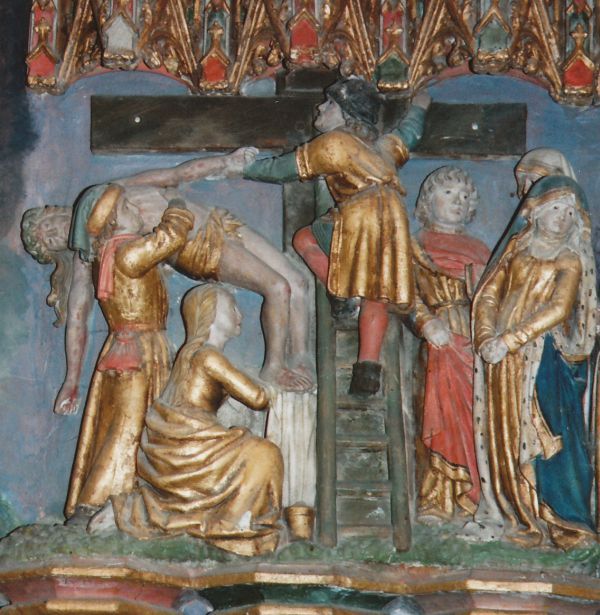 Rechts op de afbeelding Jezus' moeder. Zij heeft het gezicht afgewend, haar lijf enigszins gebogen en haar handen samengewrongen in rouw en verdriet. Achter haar de geliefde leerling Johannes en Maria, de moeder van Joses die goeddeels schuil gaat achter Jezus' moeder. De starre onbeweeglijkheid van deze drie staat in scherp contrast met de activiteit van het andere drietal. De twee mannen moeten wel Nicodemus en Jozef van Arimatea zijn. We menen Jozef te herkennen aan de beurs aan zijn ceintuur. Hij kocht immers het lijnwaad waarin Jezus straks zal rusten. Hij heeft ook aan Pilatus toestemming gevraagd om Jezus' lichaam weg te nemen. Het wordt niet met zoveel woorden gezegd, maar het zou me niet verbazen als hij ook daarvoor had moeten betalen. De ander moet dan Nicodemus zijn. Jozef torst het gewicht van Jezus' lichaam op zijn schouder. Aan de plooien van zijn gewaad te zien zet hij zich met zijn rechterbeen enigszins schrap. Nicodemus, halverwege de ladder, heeft nog juist uiterst zorgzaam Jezus' hand vast.