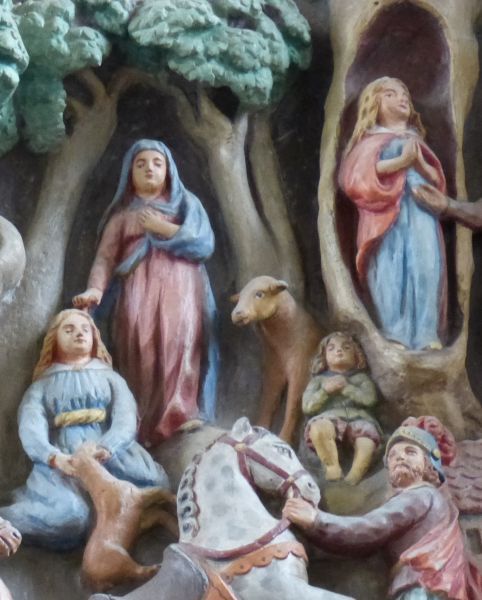 Genovefa leeft als kluizenares in een holle boom (rechts boven); zij en haar zoontje (midden) worden onder bescherming van Maria (staand links boven) in leven gehouden door een rekoe.