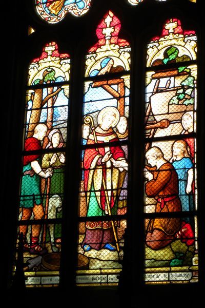 St Ouen geneest een molenaar wiens arm verlamd was omdat hij op zondag had gewerkt. ± 1870(?), glasschilderkunst.