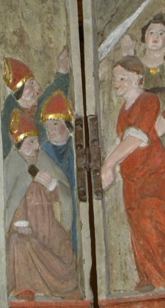 St Thégonnec met scènes uit zijn leven. feestelijke inwijding nieuwe kerk (bisschoppen en dansende vrouwen).