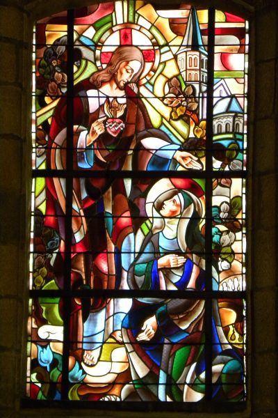 Heilig Hart verschijnt aan Marguerite-Marie. Op de achtergrond de kerk te Paray-le-Monial.