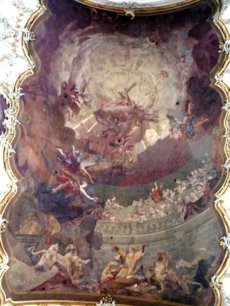 Onder valt Ignatius ten prooi aan de leeuwen, terwijl hij zicht heeft op Christus (in de bovenste kring met kruis!) in heerlijkheid.