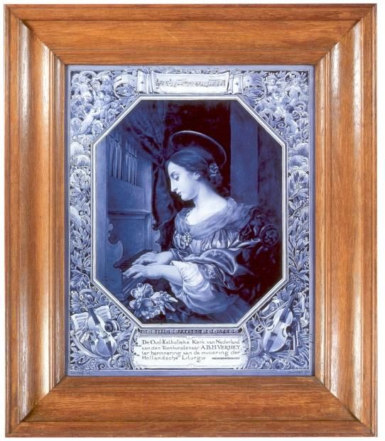 De plaquette draagt het opschrift: "De oud-katholieke kerk van Nederland aan den toonkunstenaar A.B.H. Verhey, ter herinnering aan de invoering der Hollandse liturgie".