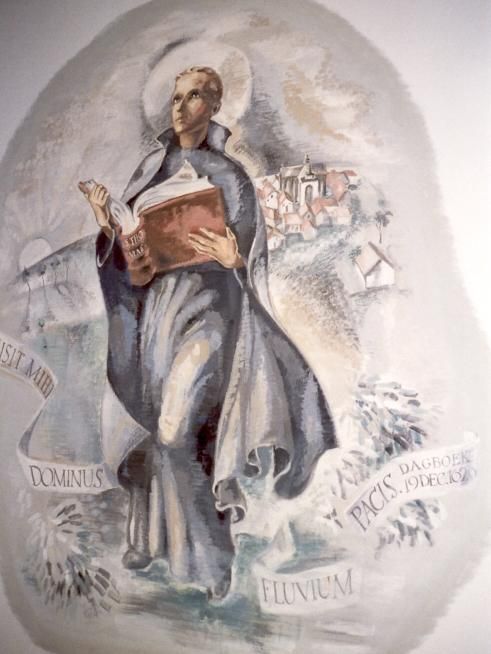 Jan Berchmans met studieboek (Thomas van Aquino); op de achtergrond zijn geboorteplaats Diest. Tekst op de banderol: ‘De Heer zond mij een stroom van vrede’.